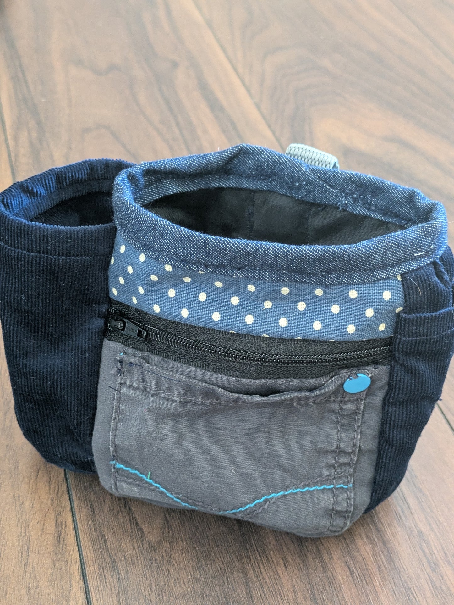 Upcycled dog treat pouch in blue and grey with pockets and wipeable lining. Made from old trousers, it attaches to a belt or loop for hands free training