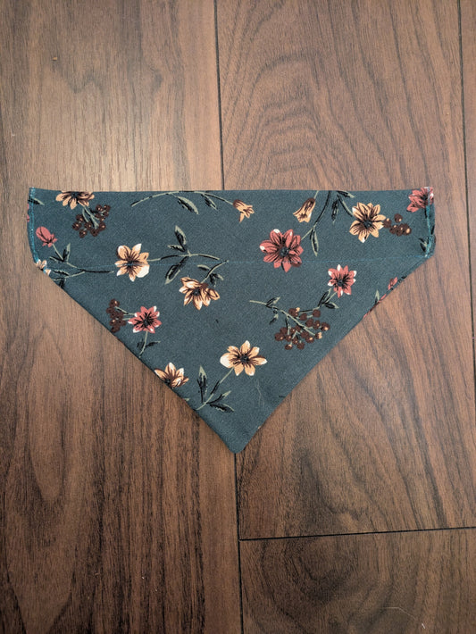 Floral over the collar dog bandana in teal with dusky pink, and beige flowers and green leaves. Upcycled from a dress