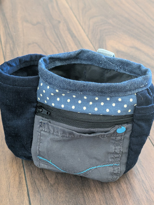 Upcycled dog treat pouch in blue and grey with pockets and wipeable lining. Made from old trousers, it attaches to a belt or loop for hands free training